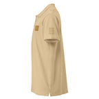 Unisex Daemon Luxury Picasso Mirrored Pique Polo Shirt with stitched label in sand color, front view showing collar and branding.