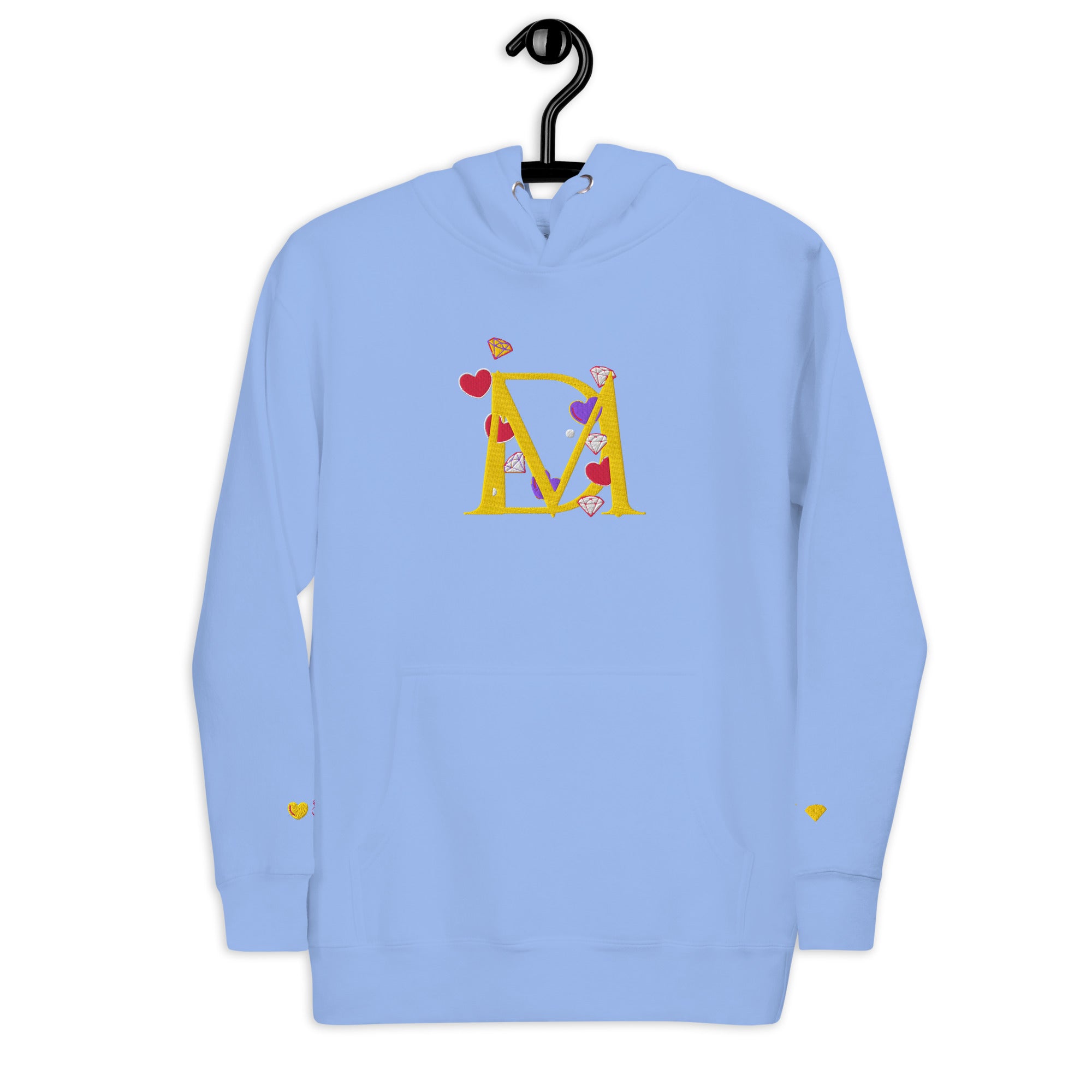 Unisex Carolina Blue hoodie from Daemon Luxury featuring the Overseas Scale (Paco) design on the front.