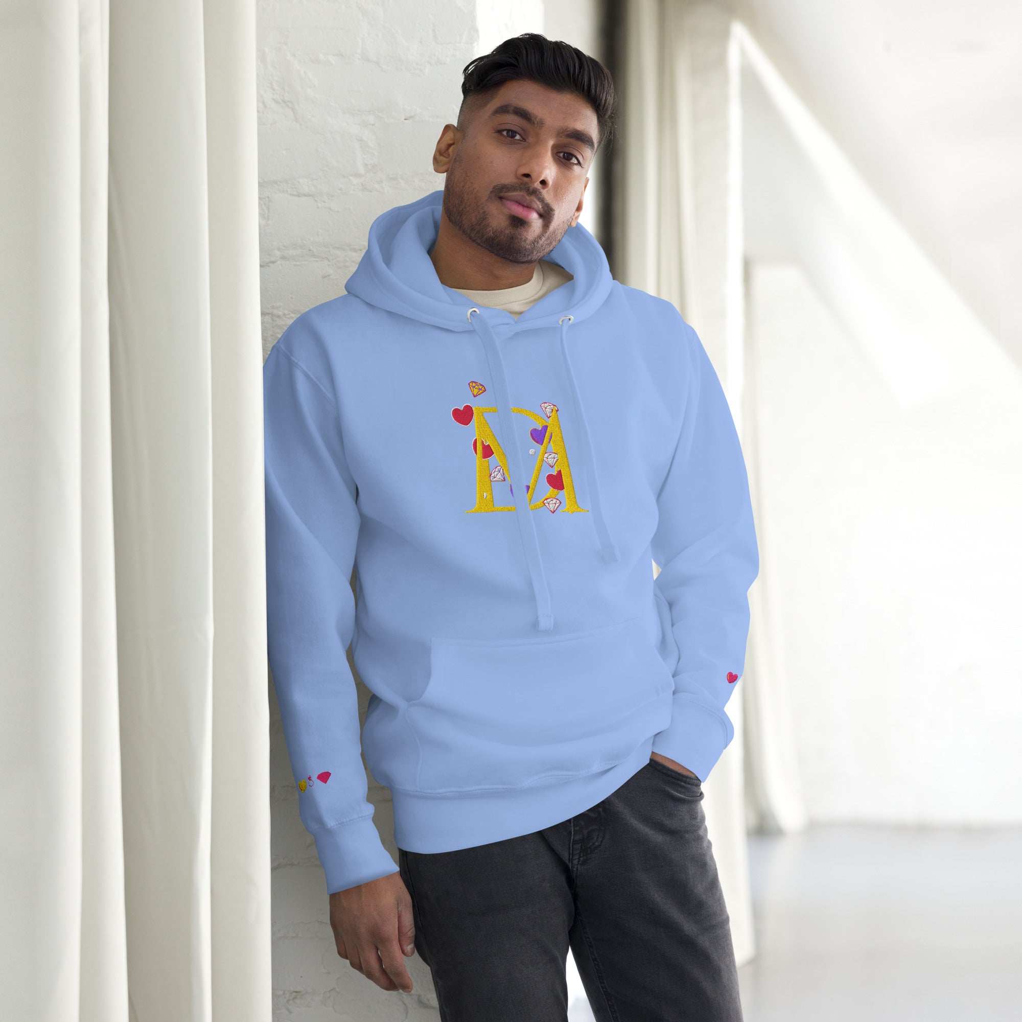 Unisex Carolina blue hoodie from Daemon Luxury featuring a front view, soft fabric, and casual fit.