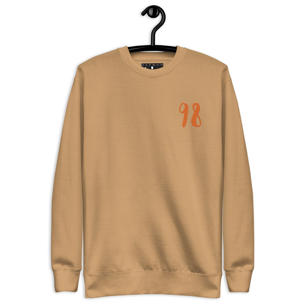 Daemon Honey Butter unisex premium khaki sweatshirt with front design, soft cotton fabric, stylish and comfortable everyday wear.