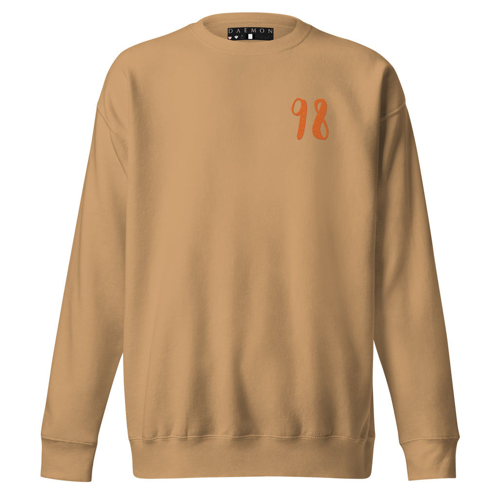 Daemon Honey Butter unisex sweatshirt in khaki, featuring a cozy, premium design with a front view and stylish fit.