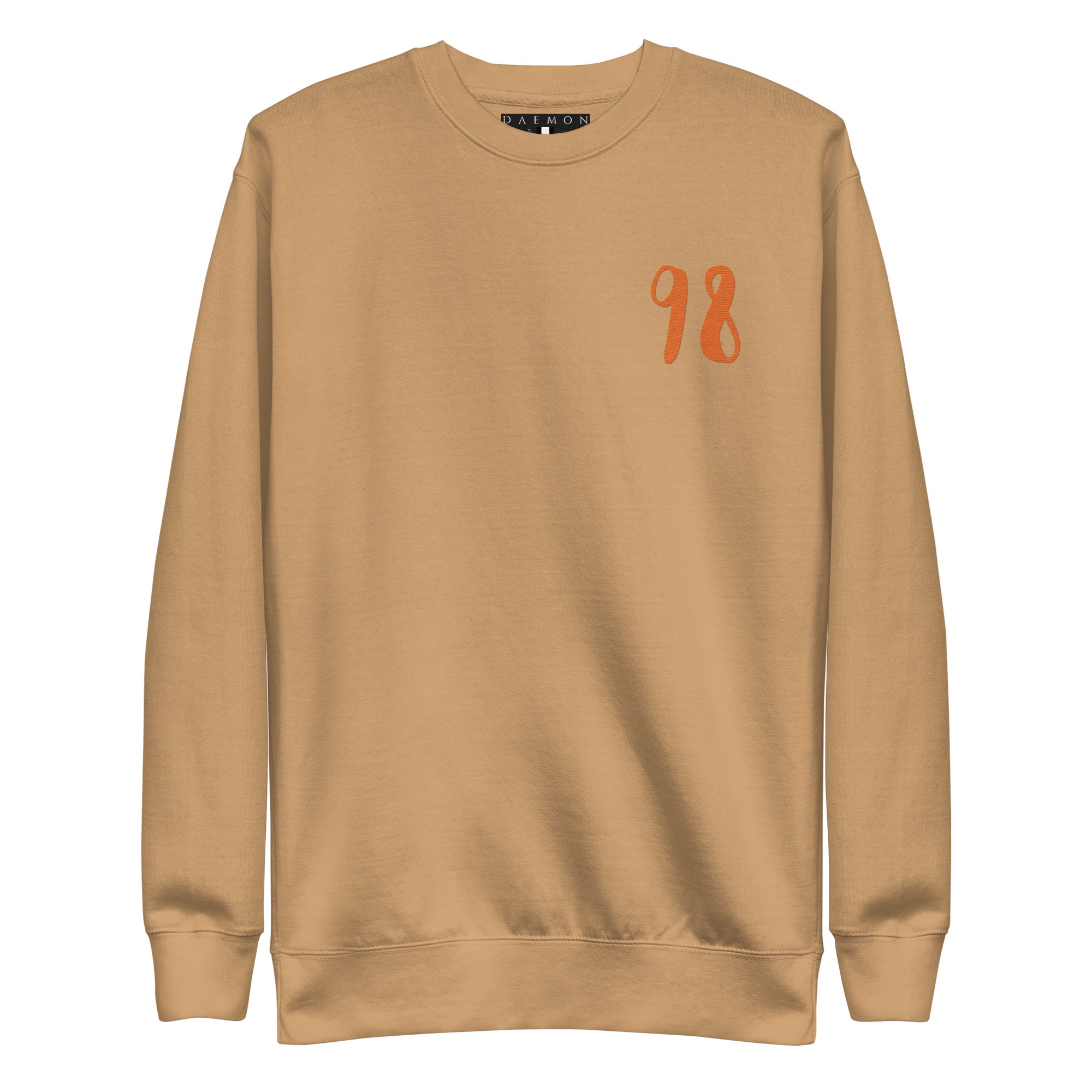 Daemon Honey Butter unisex premium sweatshirt in khaki, showcasing a comfortable, stylish front view with soft fabric details.