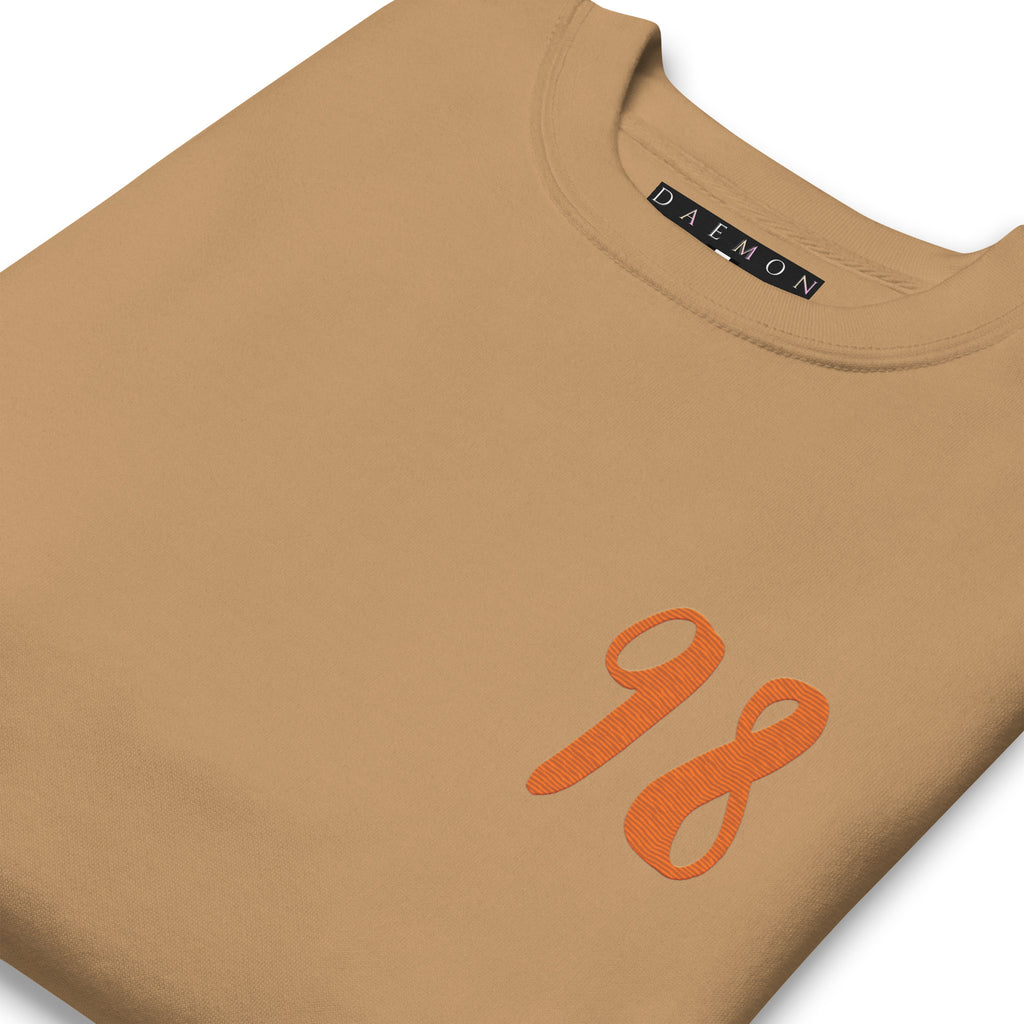 Daemon Honey Butter unisex premium khaki sweatshirt featuring a cozy, soft fabric and stylish casual fit.