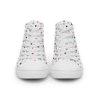 White high-top canvas shoes from Daemon Luxury's Speckled Diamonds Artica Blizzard Female collection, featuring a stylish speckled diamond pattern.