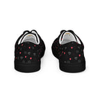 Black lace-up canvas shoes with speckled diamond pattern from Daemon Luxury's NEMESIS Female collection.