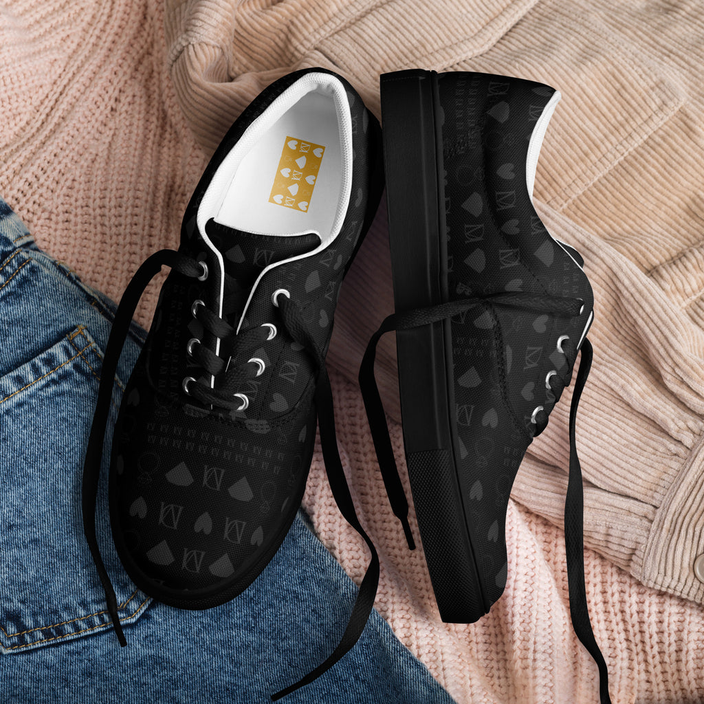 Black lace-up canvas shoes with frosted diamond accents by Daemon Luxury, featuring a sleek front view of the Platinum Dim Females collection.