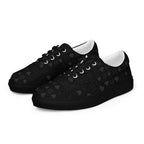 Black women's lace-up canvas shoes by Daemon Luxury with frosted diamond accents on platinum dim detailing, shown from front left.