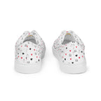 White lace-up canvas shoes featuring speckled diamond patterns from Daemon Luxury's Artica Blizzard Female collection.