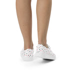 White lace-up canvas shoes featuring speckled diamond Artica Blizzard design by Daemon Luxury, shown from the back view.