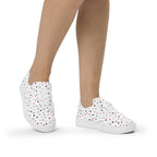 White lace-up canvas shoes featuring speckled diamond patterns from Daemon Luxury's Artica Blizzard Female collection.