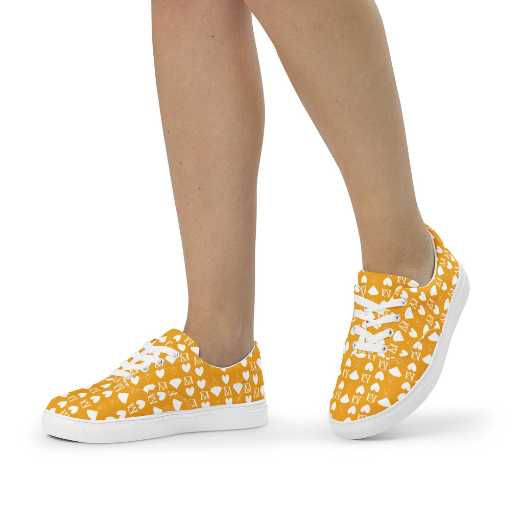 White lace-up canvas shoes for women featuring frosted diamond details by Daemon Luxury, shown from front-left angle.