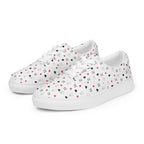 White women's lace-up canvas shoes featuring speckled diamond art design by Daemon Luxury, shown from front left angle.